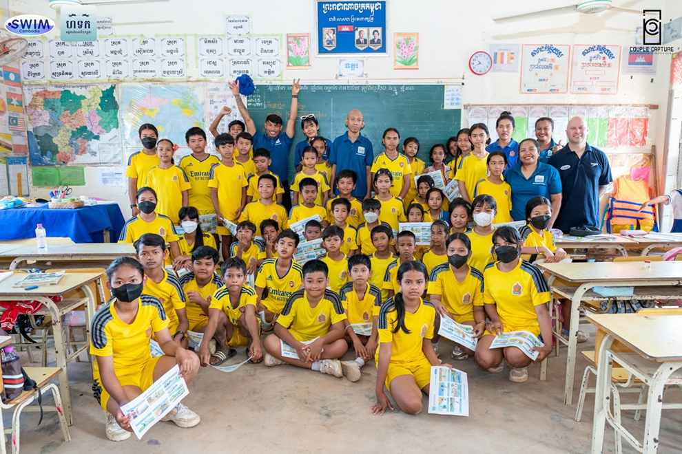 Excited graduates of one of the Hile Teuk Kampuchea (HTK) drowning prevention classes proudly display their certificates. HTK