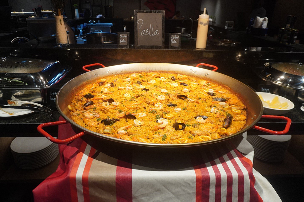 A large paellera displays executive chef Fernando Tabernero’s signature Paella with shrimp, mussels and calamari. Shaun Duff