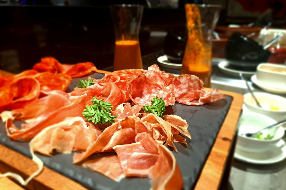 A selection of cured meats, including Serrano ham, Bayonne ham and chorizo. Joan Zheng