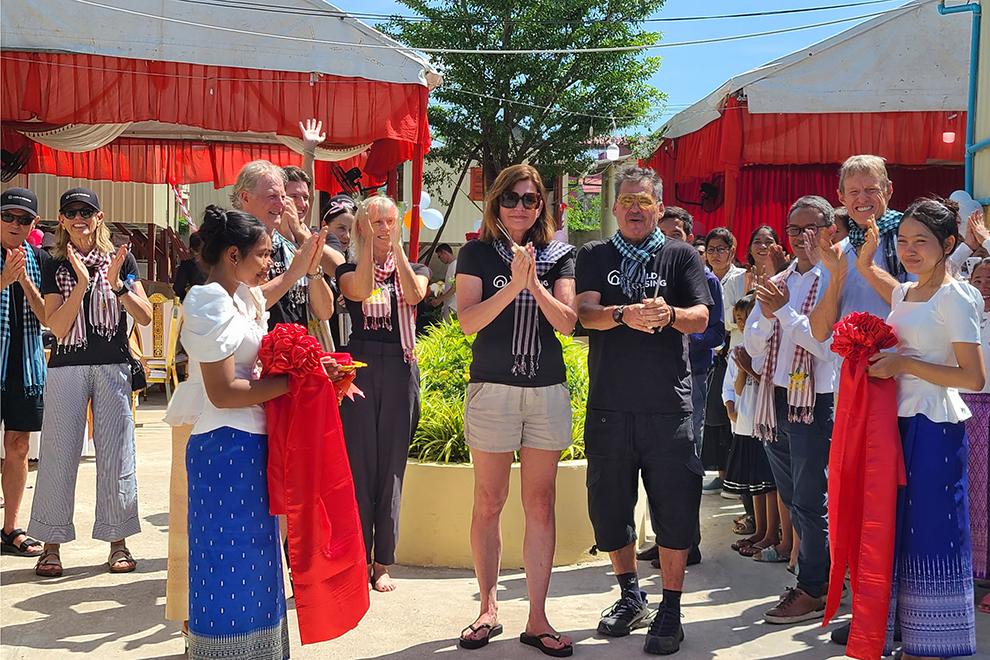 Peter and Audie Lenkov cut the ribbon to officially hand 33 new houses over to impoverished children and families. Hong Raksmey