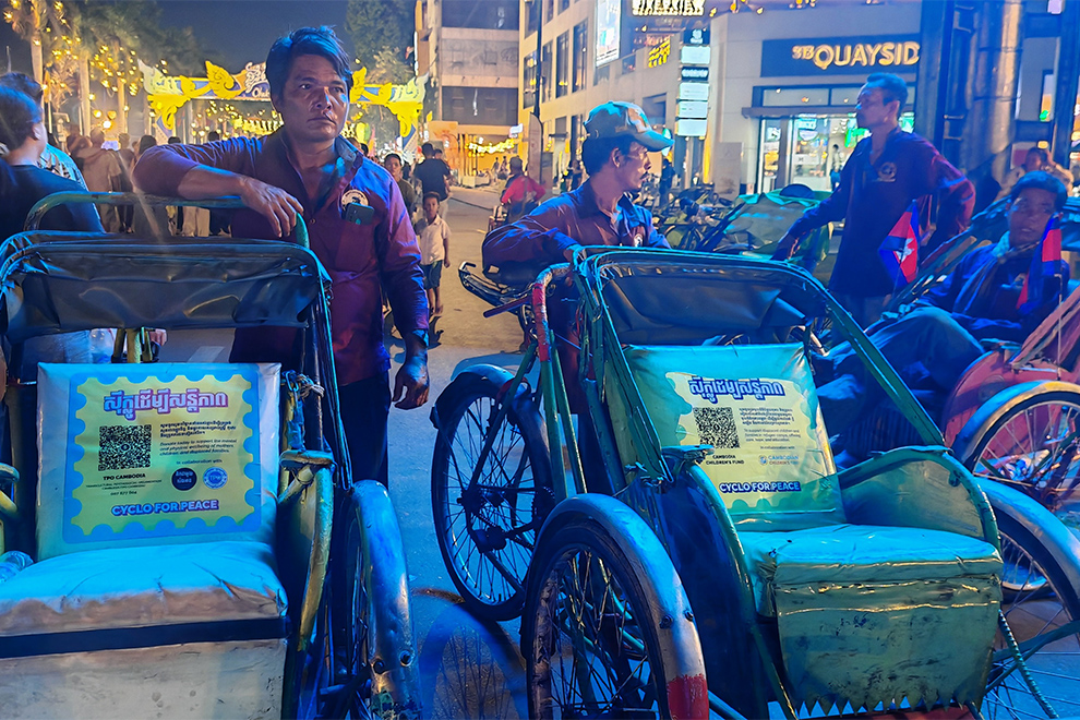 Um Sam Oeun, 48, (far left), has been peddling pedals for two decades. Hong Raksmey