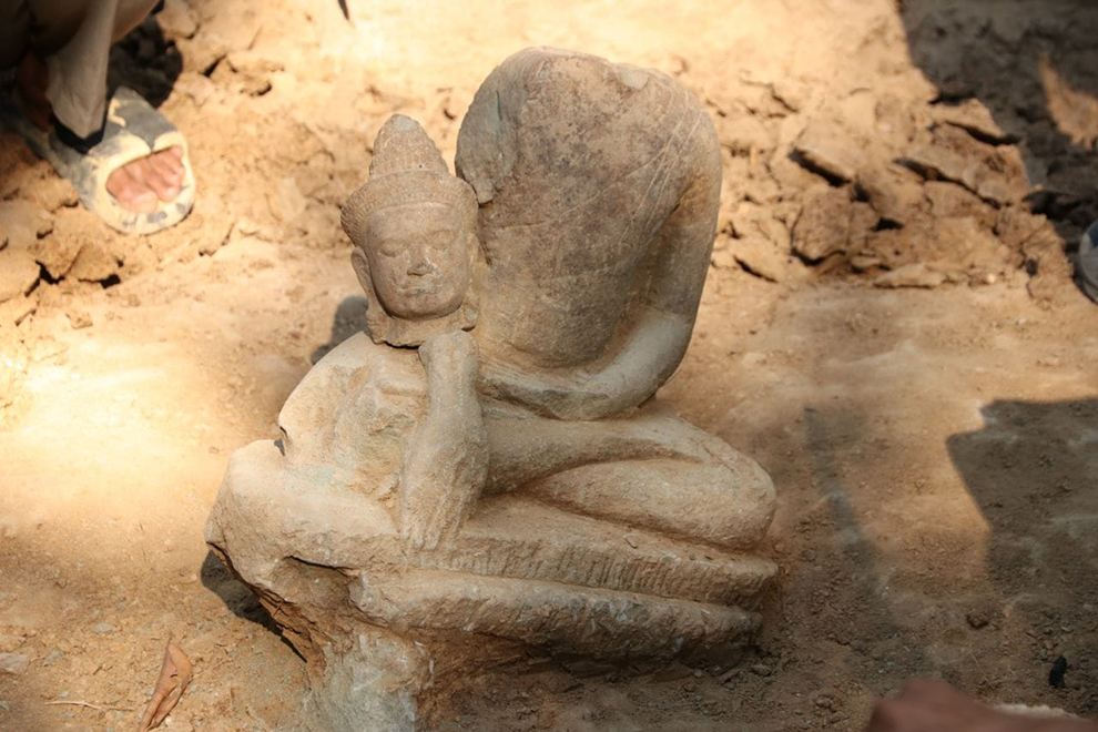 A close up image shows the detail one of the fragmented statues discovered near the Ta Prohm Temple. ANA