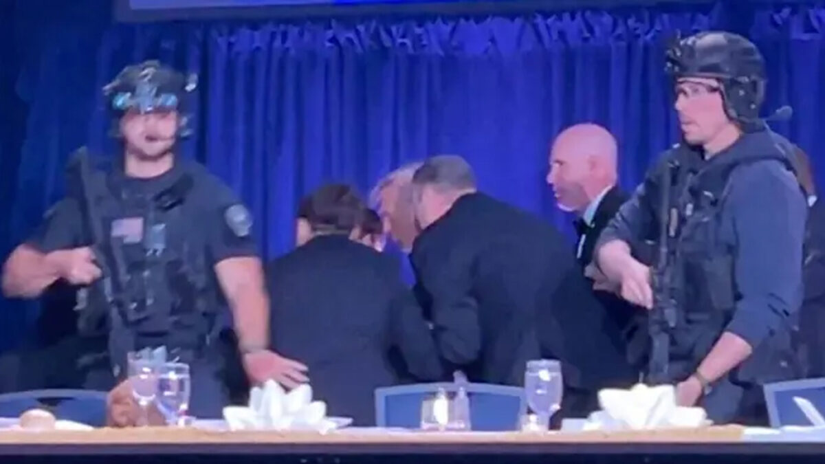 U.S. President Donald Trump is escorted out as a shooter opens fire during the annual White House Correspondents' Association dinner in Washington, D.C., U.S., April 25, 2026, in this screen capture from video. REUTERS/Bo Erickson THIS IMAGE WAS PROCESSED BY REUTERS TO ENHANCE QUALITY, AN UNPROCESSED VERSION HAS BEEN PROVIDED SEPARATELY. TPX IMAGES OF THE DAY