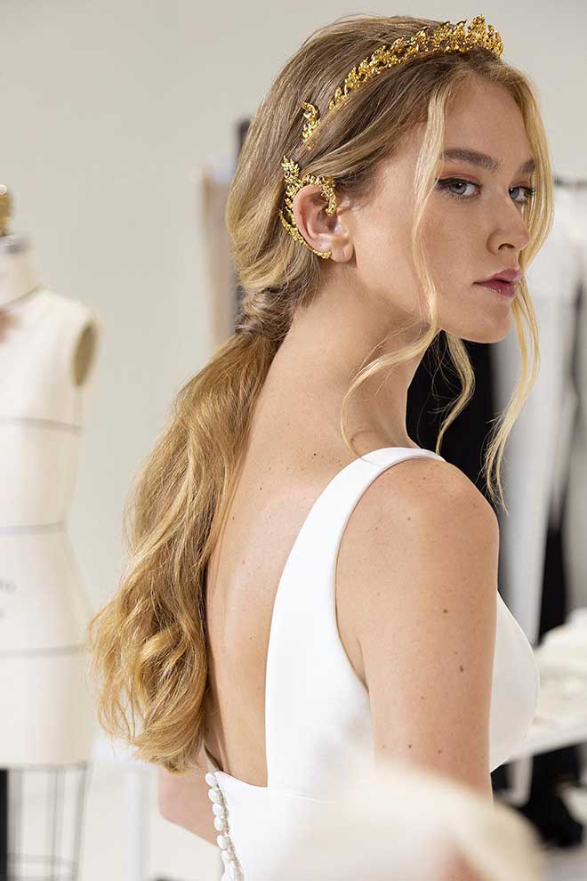 The 18k gold kbang crown and 18k gold Neang Neak ear cuff. SUPPLIED
