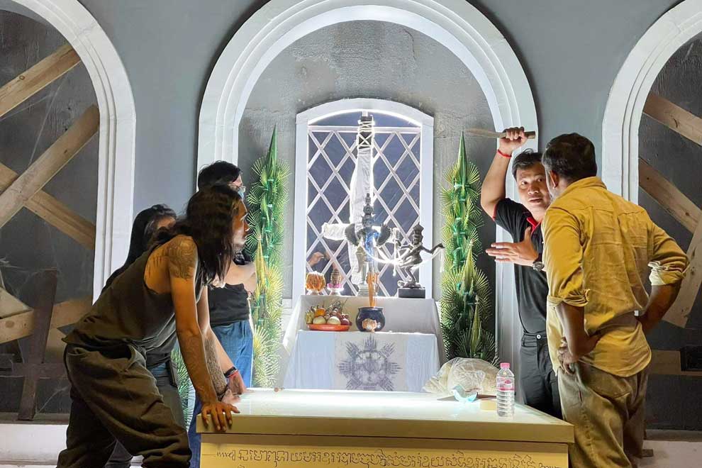 Visal, with knife, directs the cast on the set of The Ritual: Black Nun. PHOTO SUPPLIED