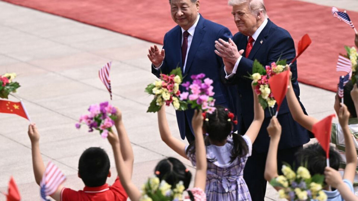 US President Trump encounters fanfare and a more confident China US President Donald Trump (R) and China's President Xi Jinping (L) greet children waving Chinese and US national flags and flowers during a welcome ceremony at the Great Hall of the People in Beijing on May 14, 2026. PHOTO: AFP